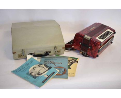 Worldmaster cased accordion with red lustre marbled case  