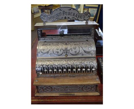 Good quality Michigan cast cash register with a scrolling design and shaped sign to top stating "Amount purchased" with an oa