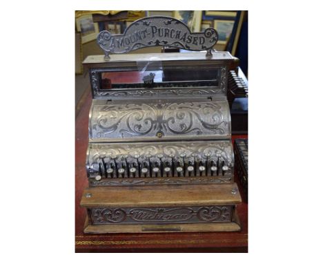 Good quality Michigan cast cash register with a scrolling design and shaped sign to top stating "Amount purchased" with an oa