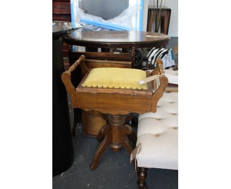 A late Victorian mahogany music stool on quadruple base together with an oak firescreen and bed tray