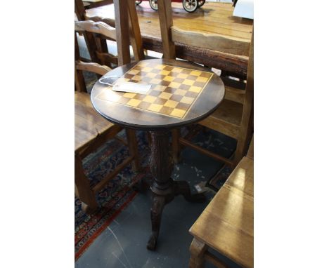 A Victorian style mahogany games table, the circular chess board top on acanthus pillar and cabriole tripod, Dia:43cm