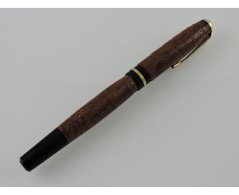 A Wyvern 101 crocodileskin covered button-filler pen, with Wyvern nib.