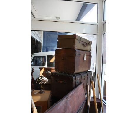 A large late Victorian wood bound canvas travelling trunk together with a later leather mounted case and 2 tin trunks