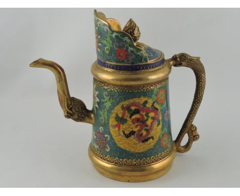 A Chinese brass and cloisonne teapot, with a dragon head spout and handle, decorated with foliate on a turquoise ground, with