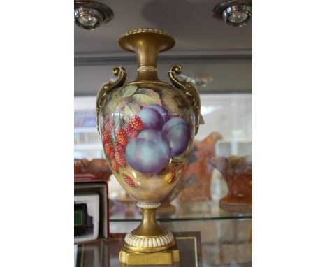 A Royal Worcester porcelain vase by Harry Ayrton painted with assorted fruit on a canted square base, dated 1969, H. 30 cm