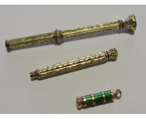 A small green enamel and yellow metal propelling pencil, together with two gold-plated propelling pencil each heavily engrave