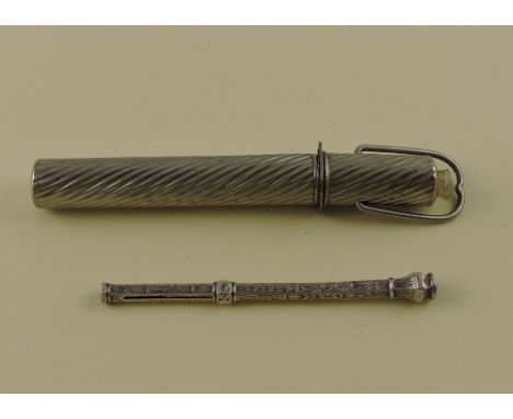 A late 19th century travelling writing etui, comprising dip pen, pencil and erase contained in a twisted, fluted case, the li