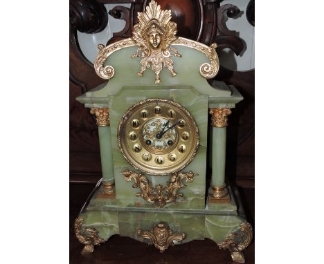 A 20th Century French gilt metal mounted onyx bracket clock the eight day drum movement with gilt Arabic chaptering, H. 45 cm