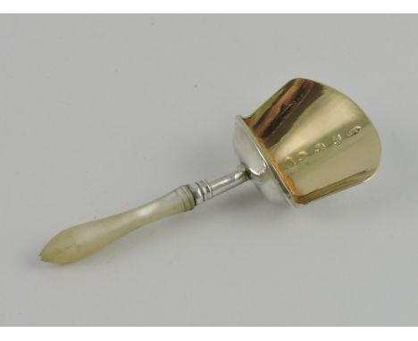 An Edwardian silver caddy spoon, Birmingham 1908 by Samuel Pemberton, with gilded bowl and a mother-of-pearl handle, engraved