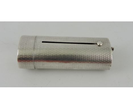 A Victorian silver travelling taper holder, London 1870, of oval form with engine turning, the hinged lid with ownership init