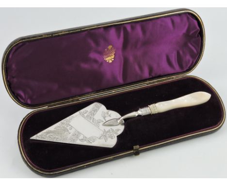 A Victorian silver trowel, Birmingham 1886 by Fredrick Elkington, engraved with birds among branches, with a mother-of-pearl 