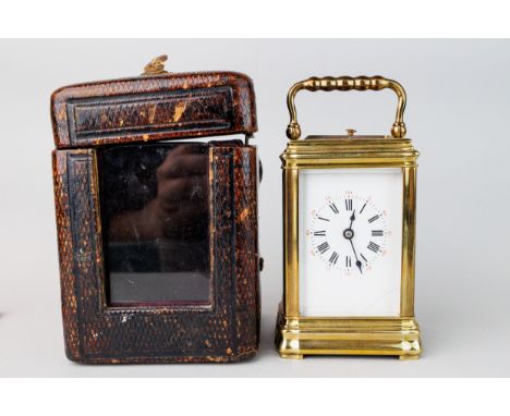 Miniature brass carriage clock in case, dating to the late 19th or early 20th Century, Size (box) 12.5x9x9 cm, Size (clock) 1