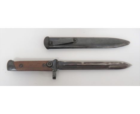 Italian M1938 Carcano Folding Blade Bayonet7 inch, single edged blade with narrow fuller.  Blued muzzle ring crossguard and c
