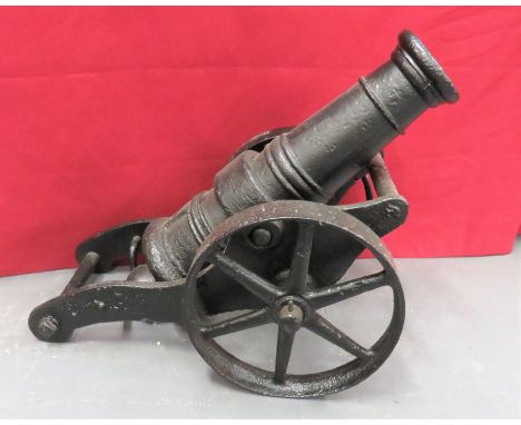Early 20th Century Decorative Garden/Signal Cannon  24 inch, cast iron barrel with ring decoration. &nbsp;Cast iron slab side