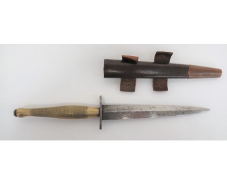 WW2 2nd Pattern Fairbairn-Sykes Commando Fighting Knife.  hilt with brass finish to the chequered grip and plain oval crossgu