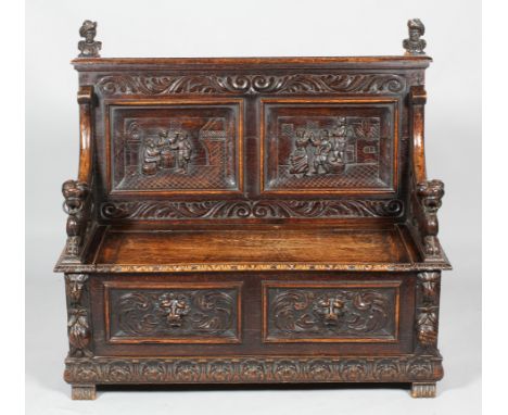 A Victorian carved oak settle, the high back with portant bust finials and panelled with Terriers style scenes within acanthu