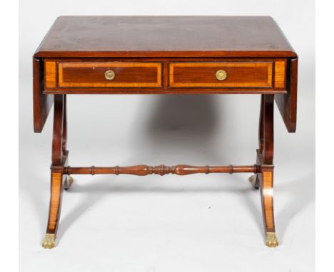 A Regency mahogany sofa table, early 19th century with satinwood cross banding, with two frieze drawers, on twin lyre shaped 