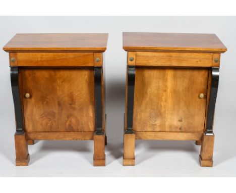 A pair of  early C20th continental mahogany empire style  bedside tables, of rectangular section with frieze drawer, flanked 