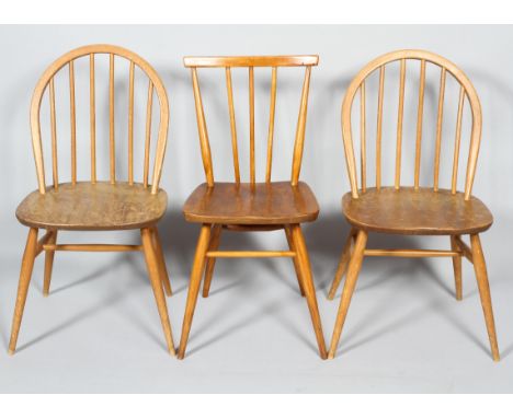 Three Ercol pale beech and elm stick back kitchen chairs, comprising : a pair with hoop backs and splayed legs and another wi