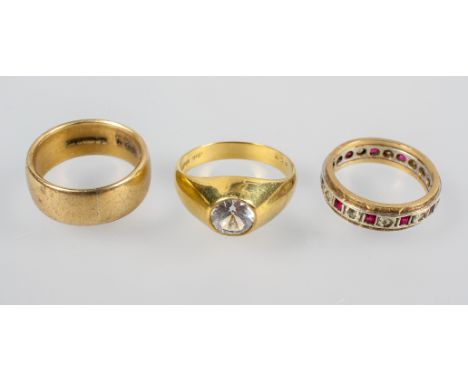 A collection of three rings to include: A single stone zircon ring; A synthetic ruby/spinel eternity ring; A 7.5mm D shape we