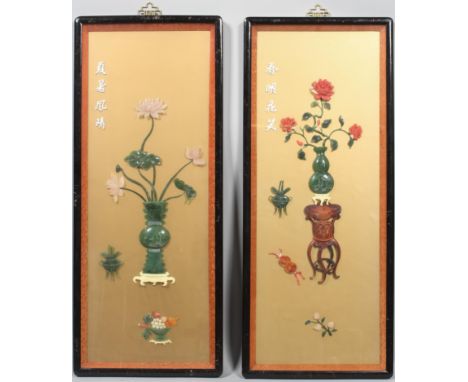 A pair of Chinese stone pictures, 20th century, each mounted with jade, agate and other stones forming a jardiniere of flower