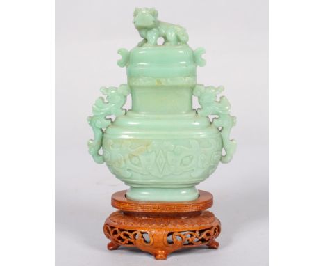 A Chinese carved jade censer, cover and hardwood stand, 20th century with dog of fo finial and pierced Kylin handles, stepped