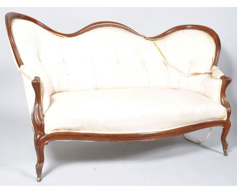 A Victorian mahogany show frame sofa with serpentine button back on cabriole legs with brass casters, 167cm wide