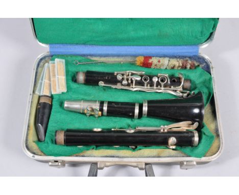 A Boosey and Hawkes Regent clarinet, in case with two mouth pieces