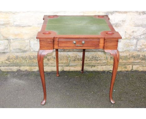 A card table; the table having green baize surface (af), dice recesses, cabriole legs on bun feet, approx 75 x 76 x 76 cms.&n