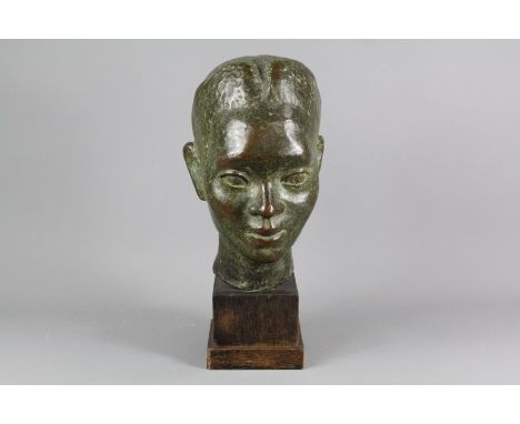 A Bronze Bust; the bust depicting a Nubian, set on a wooden plinth, overall h approx 35 cms.&nbsp;