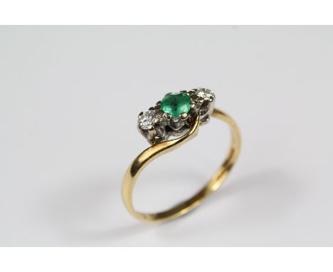 An 18ct yellow gold emerald and diamond ring, the emerald approx 3.5mm and 12 pts of dias, size K, approx 2 gms.