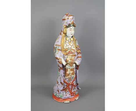 An Early 20th Century Chinese Porcelain Figure of&nbsp; Lady; the hand-painted figure wearing a garment profusely painted wit