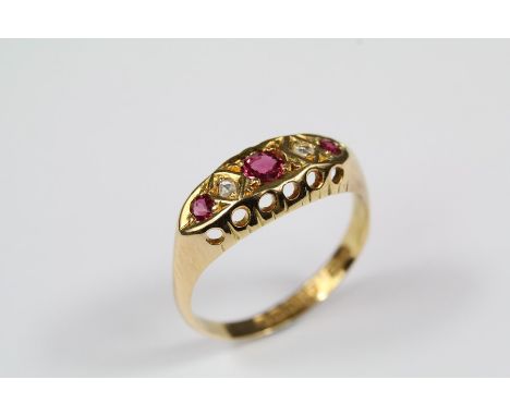 Antique 18ct yellow gold, diamond and ruby ring, the ring set with one 3.5 mm ruby, two 2.25mm ruby and two 1pt rose-cut dias