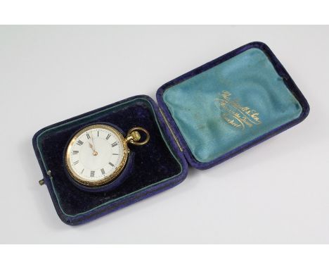 An 18ct yellow gold Continental self-winding open-faced pocket watch. The watch having shallow scroll engraving to back and s