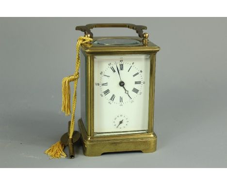 A French brass carriage clock, white enamel face with Roman dial, approx 12 x 8 x 7.5 cmsCondition for this Lot - Sale 18/12/