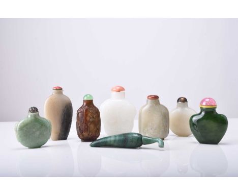 A group of eight Chinese jade and hardstone snuff bottles, 19th/20th centuryFour of flattened ovoid form ranging from pale ce