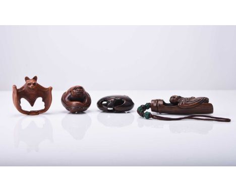 A group of four Japanese wood netsuke modelled as bats, 20th centuryStylistically modelled and inset with horn eyes, signed.4