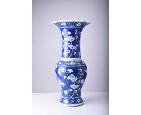 A Chinese blue and white yenyen vase, 19th centuryDecorated with a prunus pattern on 'cracked ice' ground, between panelled b