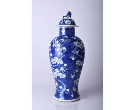 A Chinese blue and white vase and cover, Kangxi four-character mark but 19th centuryOf baluster form and decorated with flowe