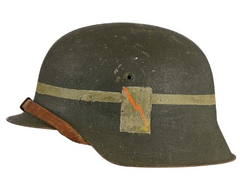 German Third Reich WW2 M42 steel helmetA good raw edge example with painted green/grey finish bearing white line and white pa