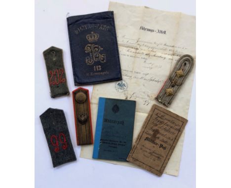 WW1 Imperial German Shoulder straps, Pay Books etc.A selection of four WW1 period shoulder straps, including field grey “202”