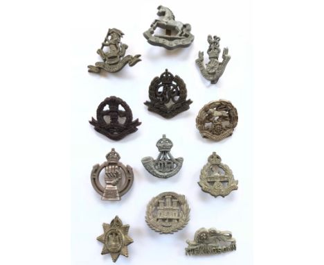 12 WW2 plastic economy cap badges.West Riding ... King’s Liverpool ... Loyals (some distortion) ... Middlesex ... Military Po