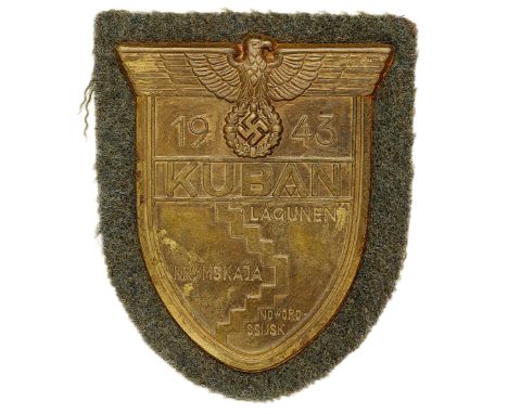 German Third Reich WW2 Army and Waffen SS Kuban Arm shield.A good dull brass example on field grey cloth. Eagle and swastika 