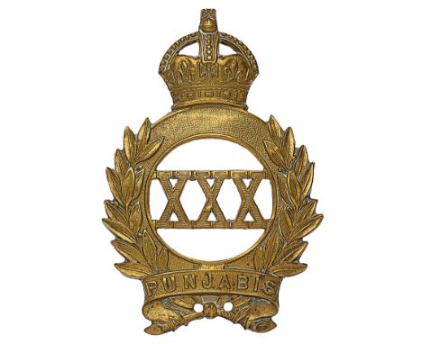 Indian Army 30th Punjabis brass pagri badge circa 1903-22.A good British made die-stamped example.  Crowned quoit resting in 