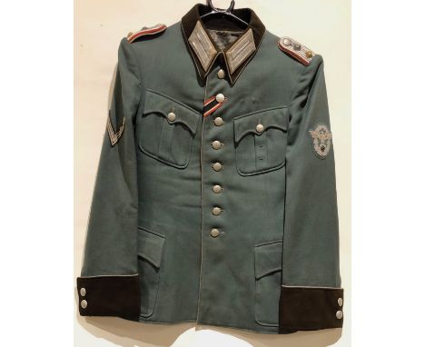 German Third Reich Police Captain’s tunic.A fine four pocket example by Pfennig &amp; Hoppe, Duisburg in green cloth with mou