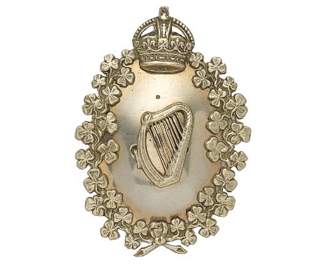 South African Irish Rifles Piper’s head-dress plate.A good silver plated pre 1952 example. Within crowned shamrock sprays, th