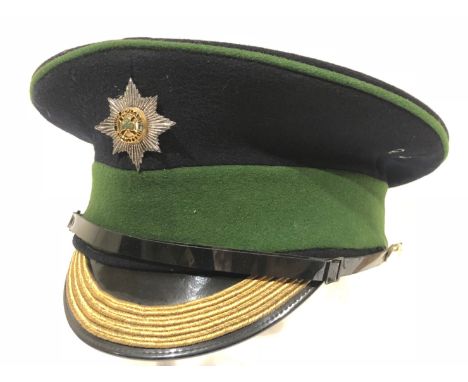 Irish Guards Warrant Officer 2 Dress Cap.A post 1953 example dark blue body with green cap band mounted with a silvered and e