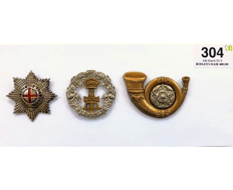Coldstream Guards Warrant Officer’s cap star and two others.A fine cut silvered example; the gilt Garter pierced with blue en