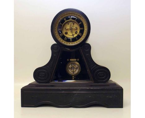 French black marble drum head mantel clock with pendulum window, circa 1870. A condition report is not available for this lot