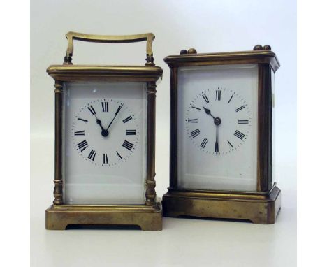 Two French brass carriage clock with white enamel dials. A condition report is not available for this lot.  Damage, defects, 
